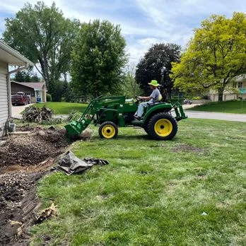a man driving a tractor